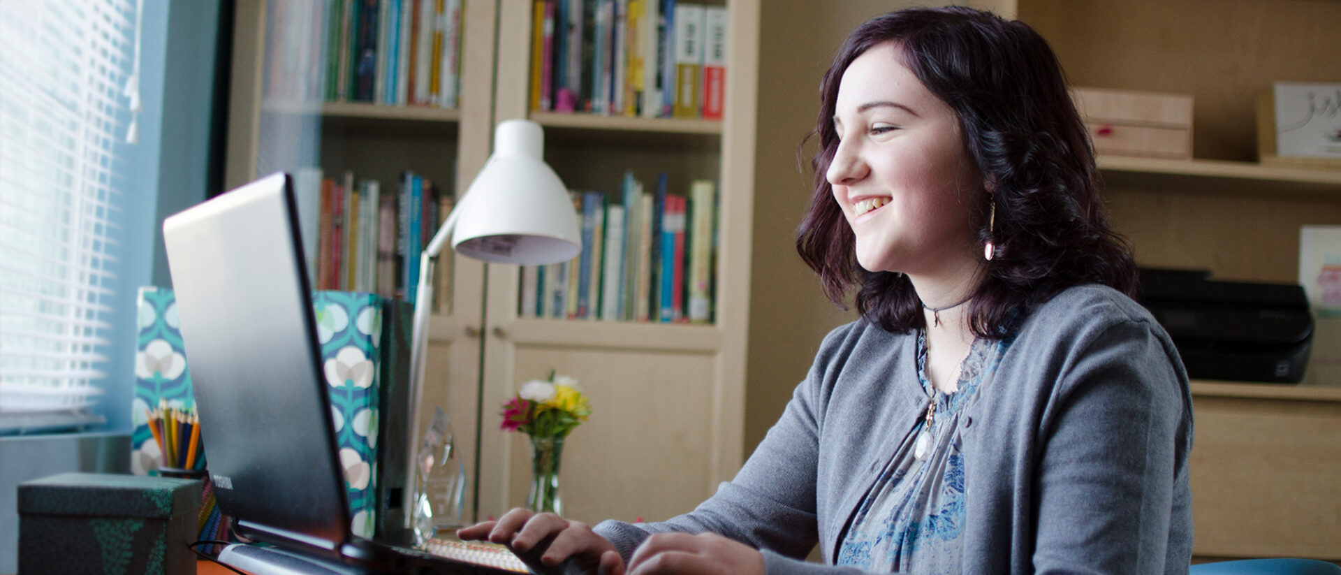 Girl attending to an online class at home