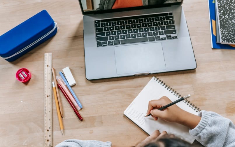 computer, notebook and pencil