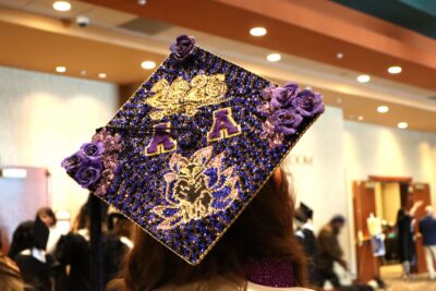 Purple graduation hat with the letter A on it